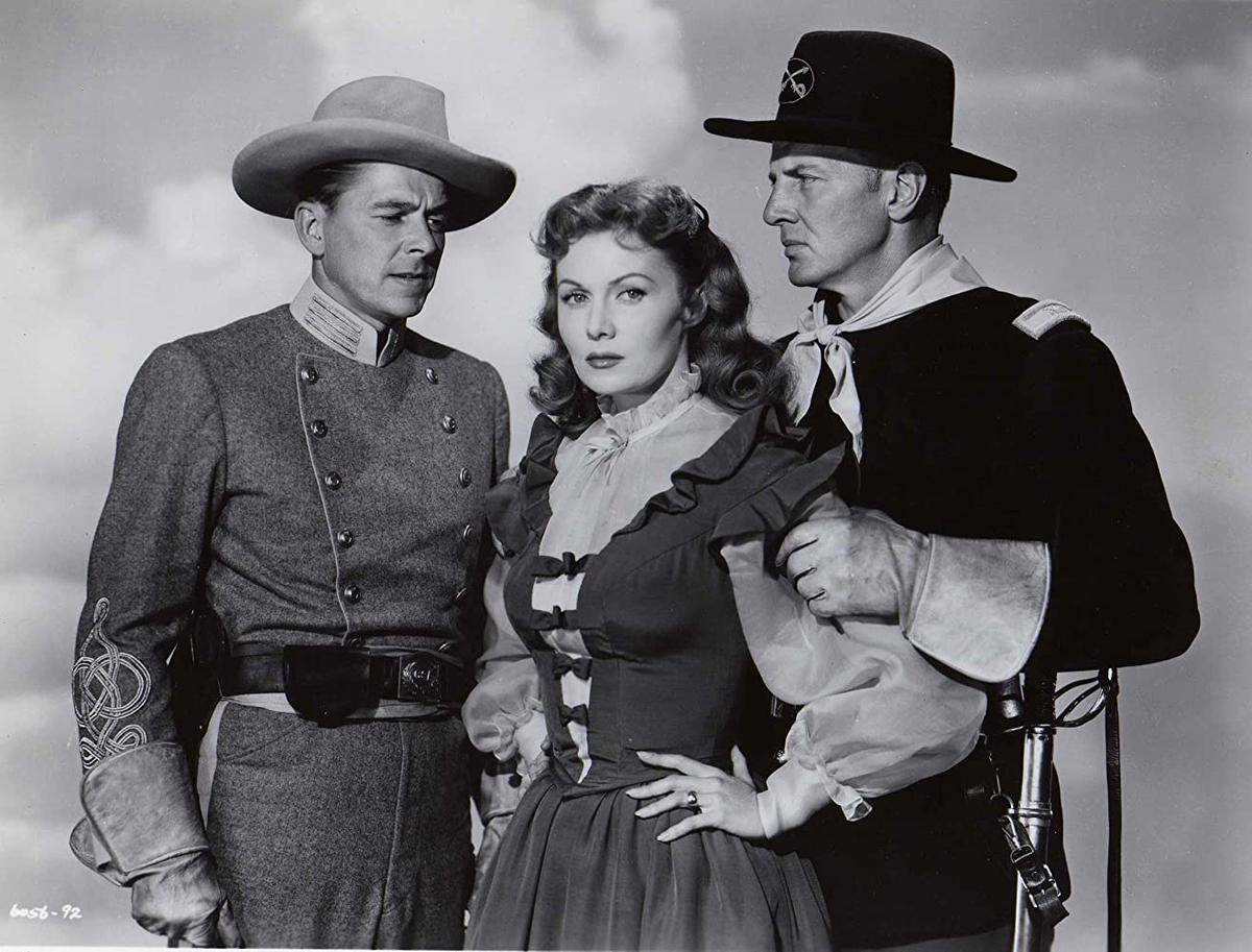 (L–R) Ronald Reagan, Rhonda Fleming, and Bruce Bennett in 1951’s “The Last Outpost.” Reagan's natural charisma in front of the camera helped him gain rapport with the American public. (Paramount Pictures)