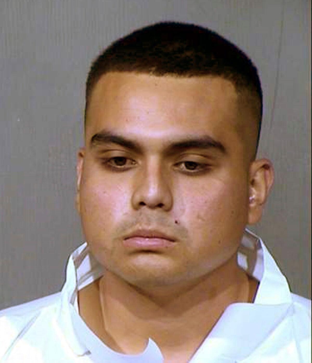 This booking photo provided by the Maricopa County Sheriff's Office shows 20-year-old Armando Hernandez Jr., who was arrested on suspicion of aggravated assault and other crimes in a shooting near a shopping and entertainment district in Glendale, Ariz, on May 20, 2020. (Maricopa County Sheriff's Office via AP)