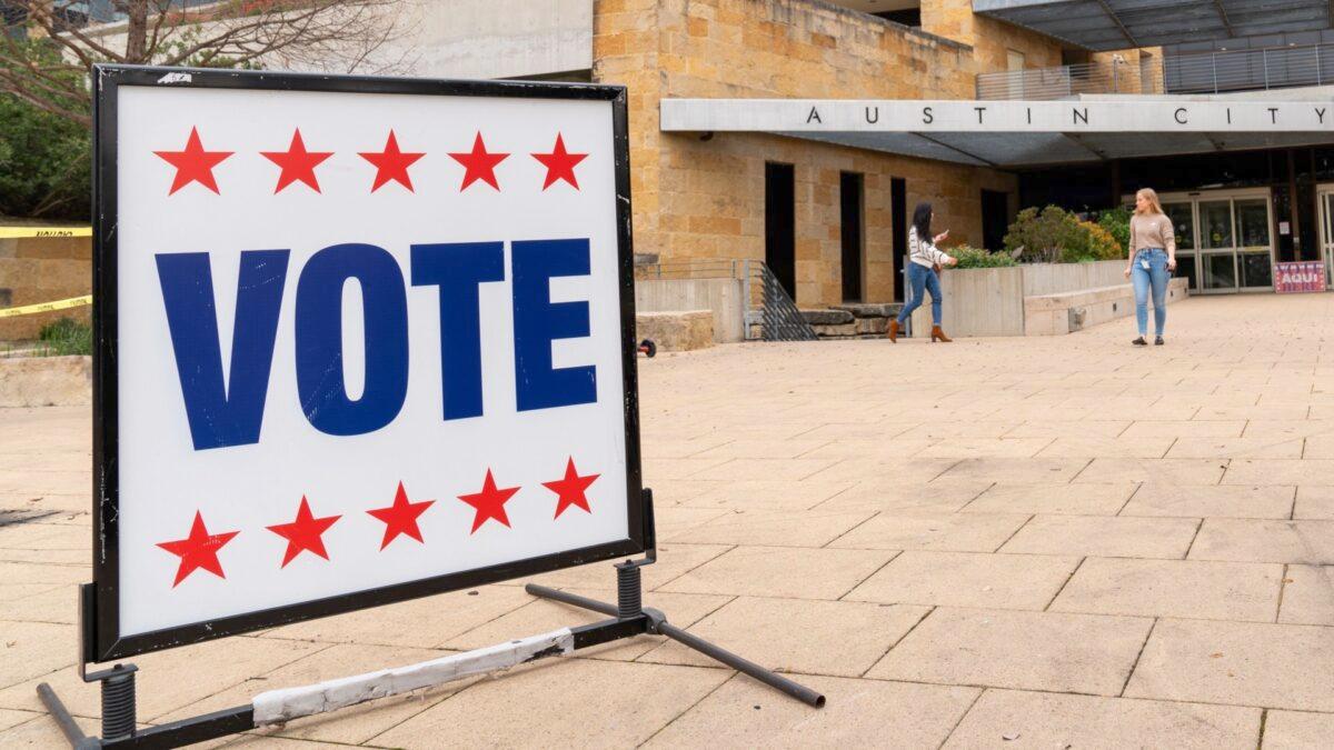 Voters enter and exit the Austin City Hall during the presidential primary in Austin, Texas, on Super Tuesday on March 3, 2020. (Suzanne Cordeiro/AFP via Getty Images)