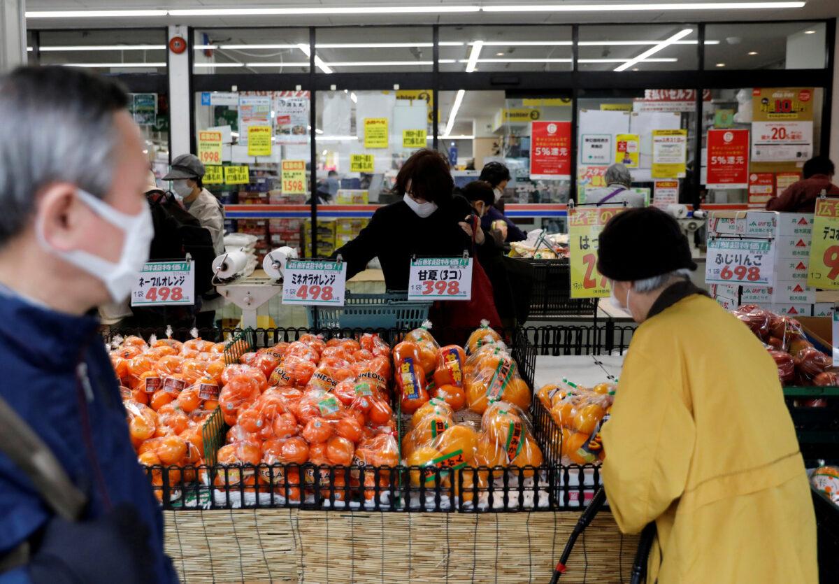 Shoppers at a supermarket in Tokyo, Japan, on March 27, 2020. (Issei Kato/Reuters)