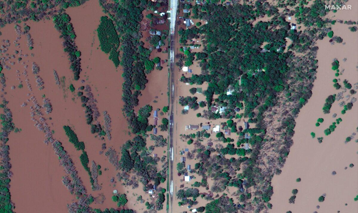 Homes and other buildings surrounded by floodwaters in Midland, Mich., on May 20, 2020. (Maxar Technologies via AP)