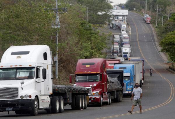 Trucks are parked in a queue at the border between Costa Rica and Nicaragua, after Nicaragua's government closed the border for freight traffic, during the outbreak of the CCP virus (COVID-19), in Penas Blancas, Costa Rica May 21, 2020. (Juan Carlos Ulate/Reuters)
