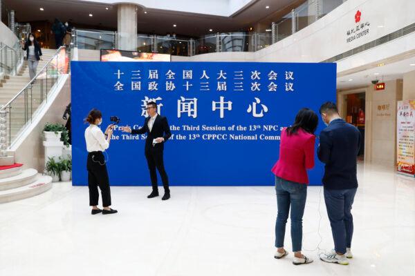 Journalists gather at the Media Center, a building where Lianghui’s News Center is located, in Beijing, China on May 20, 2020. (Thomas Peter - Pool/Getty Images)