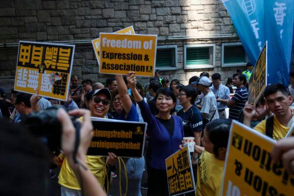 Protesters march during a demonstration against Article 23 and bans on freedom of association in Hong Kong on July 21, 2018. (VIVEK PRAKASH/AFP via Getty Images)