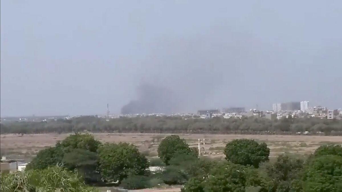 A plume of smoke is seen after the crash of a PIA aircraft in Karachi, Pakistan on May 22, 2020. (Shahabnafees/Twitter via Reuters)