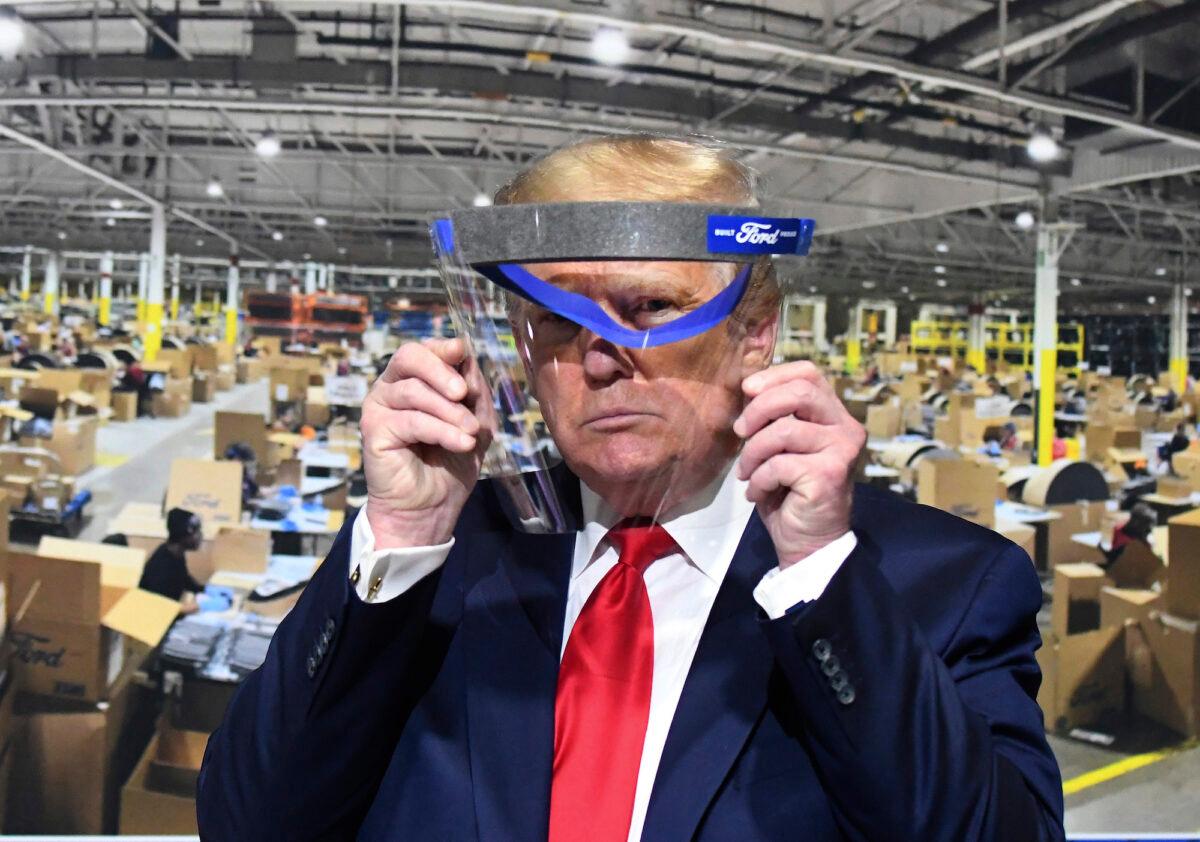President Donald Trump looks through a face shield while touring Ford Motor Co.'s Rawsonville Components Plant in Ypsilanti, Mich., on May 21, 2020. (Daniel Mears/The Detroit News)