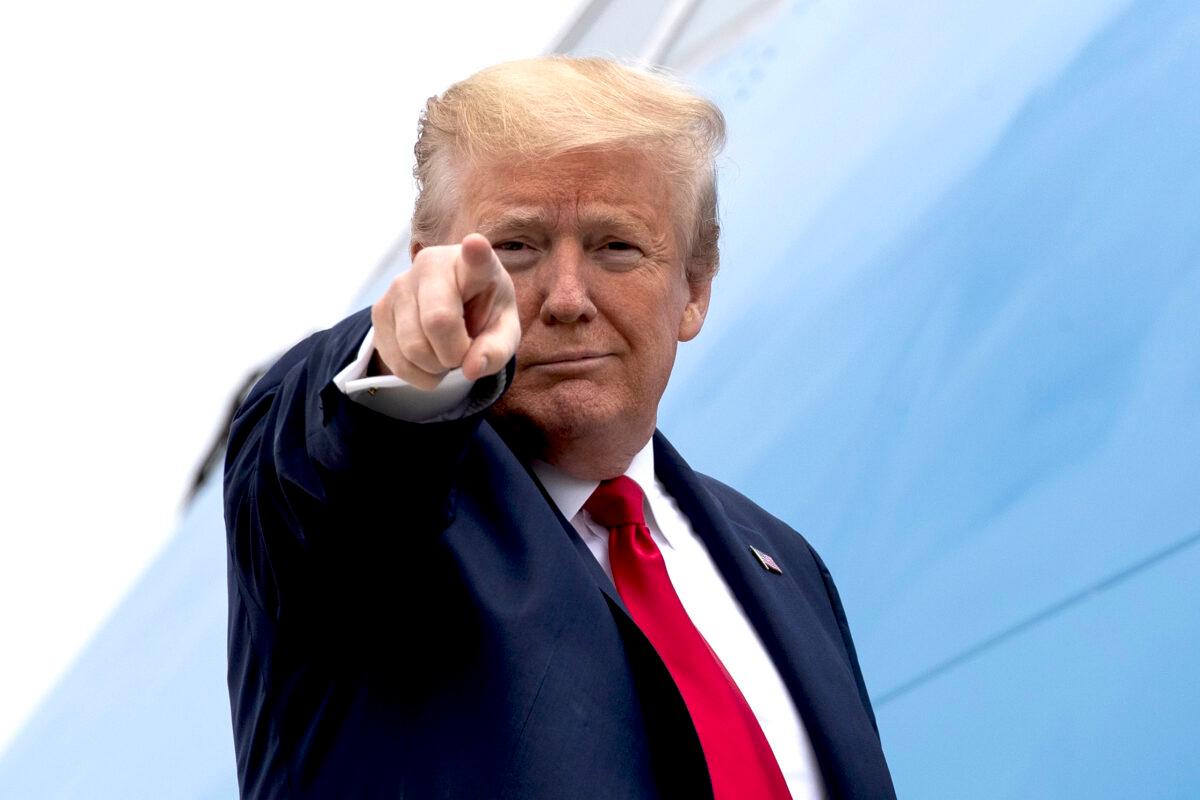 President Donald Trump points while boarding Air Force One as he departs at Andrews Air Force Base, Md., on May 21, 2020. (Alex Brandon/AP Photo)
