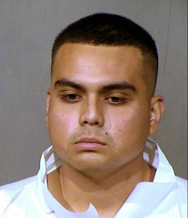 This booking photo provided by the Maricopa County Sheriff's Office shows 20-year-old Armando Hernandez Jr., who was arrested on suspicion of aggravated assault and other crimes in a shooting near a shopping and entertainment district in Glendale, Ariz. on May 20, 2020. (Maricopa County Sheriff's Office via AP)