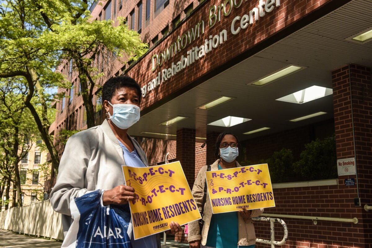 Nursing home workers hold a vigil outside of the Downtown Brooklyn Nursing and Rehabilitation Center in New York, N.Y. on May 21, 2020. (Stephanie Keith/Getty Images)