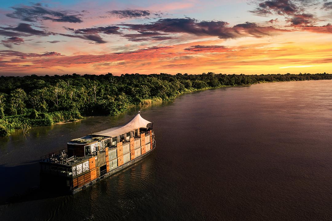 Cruising is a unique way of seeing the Amazon rainforest.—the earth's greatest wilderness Above, the Aria Amazon at sunset. (Courtesy of Aqua Expeditions)