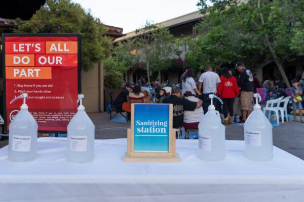 Churchgoers attending an outdoor service gather behind a sanitizing station at Calvary Chapel Chino Hills in Chino Hills, Calif. (Courtesy of Calvary Chapel Chino Hills)