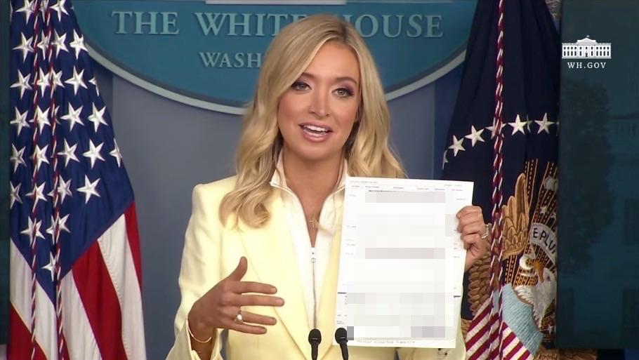 White House press secretary Kayleigh McEnany announces that the president has donated his quarterly salary to help fight COVID-19, on May 22, 2020. The Epoch Times has blurred out the information on the check for confidentiality purposes. (Screengrab via YouTube/White House)