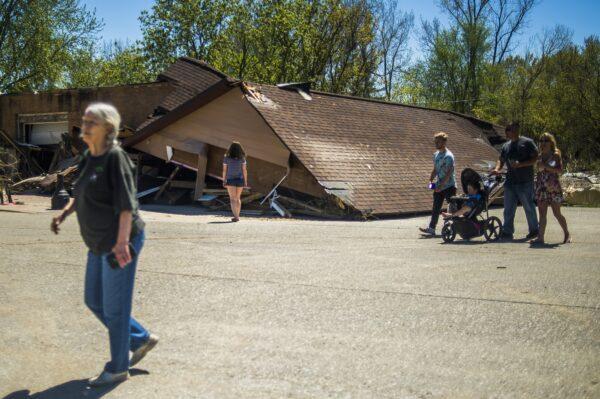 Residents survey the destruction in downtown Sanford, Michigan, on May 21, 2020. (Katy Kildee/Midland Daily News via AP)