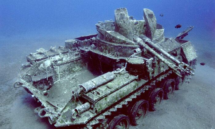 Underwater Photographer Takes Eerie Images of Sunken Tank Trapped in Time Under the Red Sea