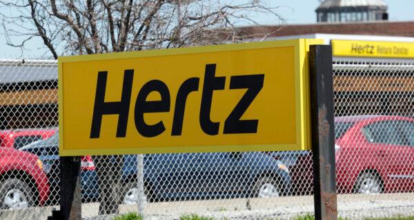 A Hertz rental car sign is placed outside a rental lot near Detroit Metropolitan Airport in Romulus, Michigan, on May 9, 2011. (Rebecca Cook/Reuters)