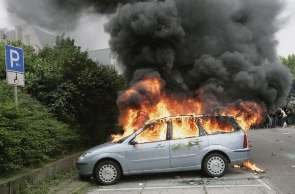 A stock photo of a car on fire. (Ralph Orlowski/Getty Images)