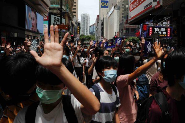 Anti-government protesters march against Beijing's plans to impose national security legislation in Hong Kong on May 24, 2020. (Tyrone Siu/Reuters)