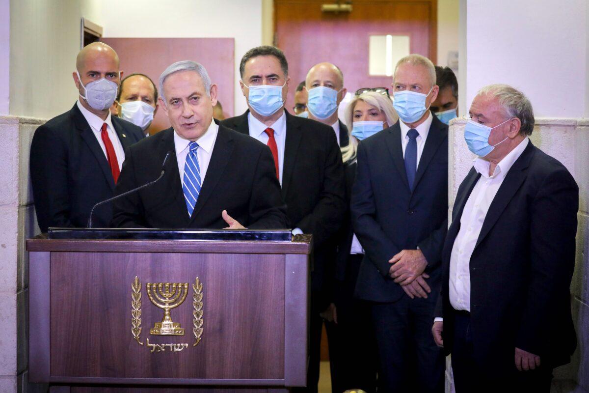 Israeli Prime Minister Benjamin Netanyahu delivers a statement before entering a courtroom at the district court of Jerusalem on May 24, 2020, during the first day of his corruption trial. (Yonathan Sindel/AFP via Getty Images)