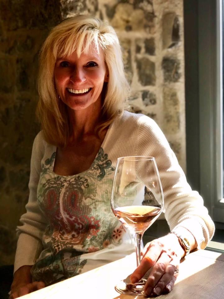 The author with a glass of Franconian wine in Franconia, a wine-growing region of Bavaria. (Courtesy of Janna Graber)