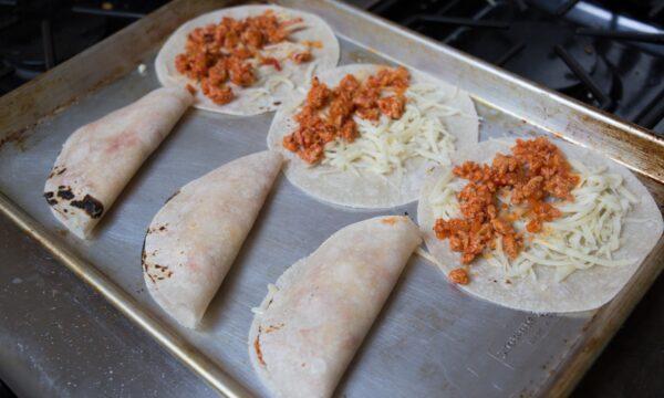 Tuck the meat and cheese into the tortillas, lightly coat them with oil, and bake them in the oven until crispy. (Photo by Caroline Chambers)