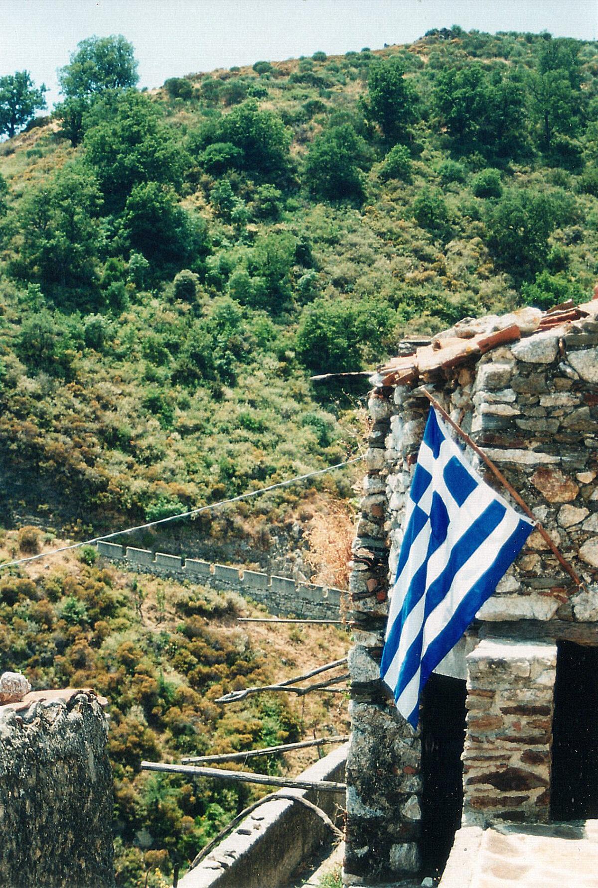 A Greek flag hanging from a home in Gallicianò. (Kevin Revolinski)
