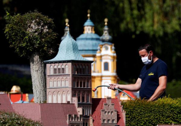 A worker wearing a protective mask is seen during the reopening of 'mini-Europe' theme park where people can wonder across small scale models of European capitals landmarks as Belgium began easing lockdown restrictions amid the CCP virus disease outbreak, in Brussels, Belgium, on May 18, 2020. (Francois Lenoir/File Photo/Reuters)