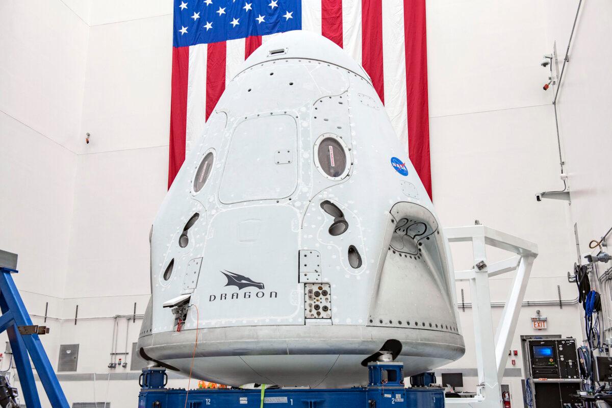 In April 2020, the Crew Dragon spacecraft undergoing final processing at Cape Canaveral Air Force Station, Fla., in preparation for the May 27, 2020, Demo-2 launch with NASA astronauts Bob Behnken and Doug Hurley to the International Space Station for NASA's Commercial Crew Program. (SpaceX via AP)