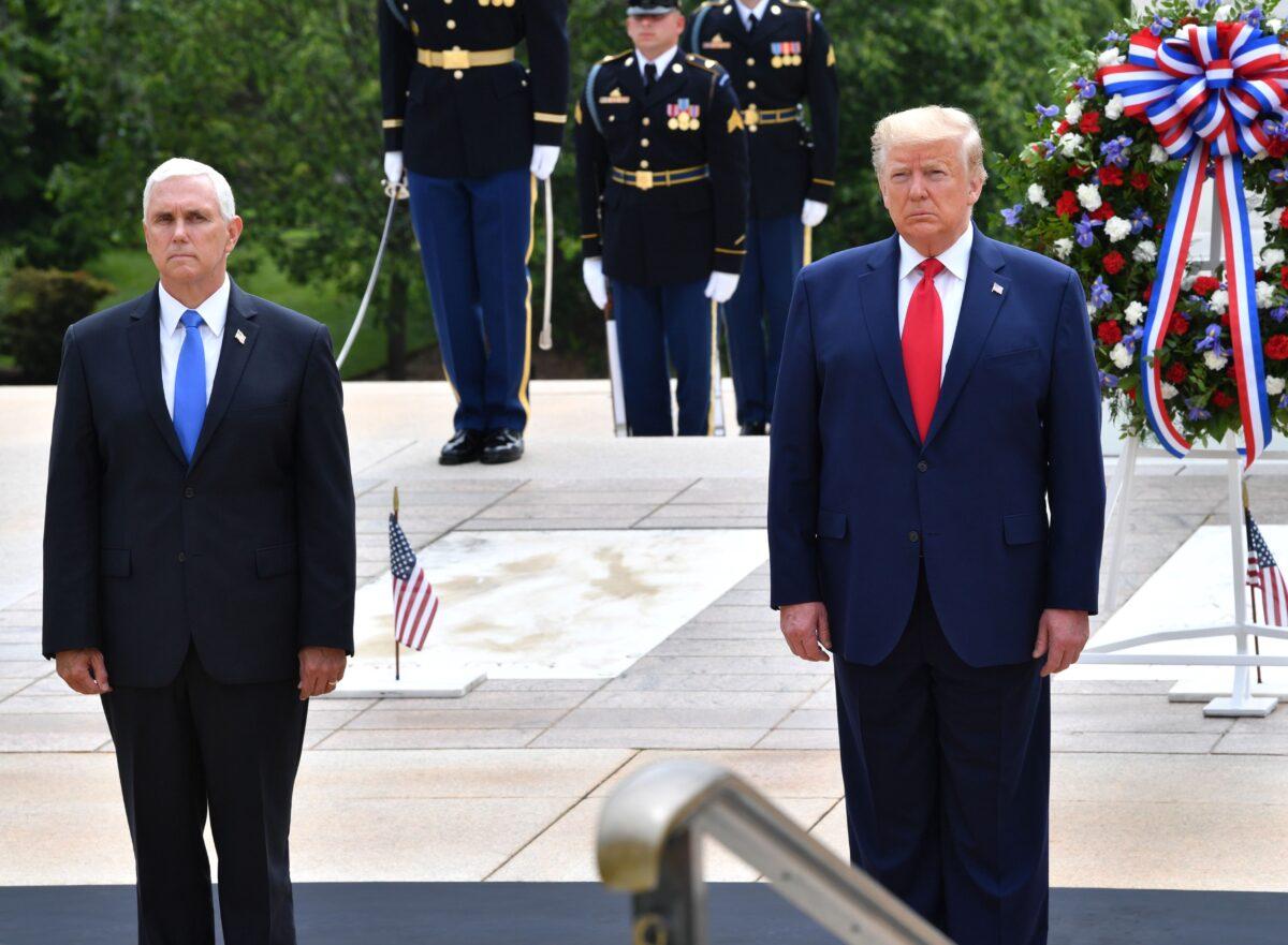 President Donald Trump(R) and Vice President Mike Pence participate in a Wreath Laying Ceremony at the Tomb of the Unknown Soldier at Arlington National Cemetery to commemorate Memorial Day in Arlington, Va., on May 25, 2020. (Nicholas Kamm/AFP via Getty Images)
