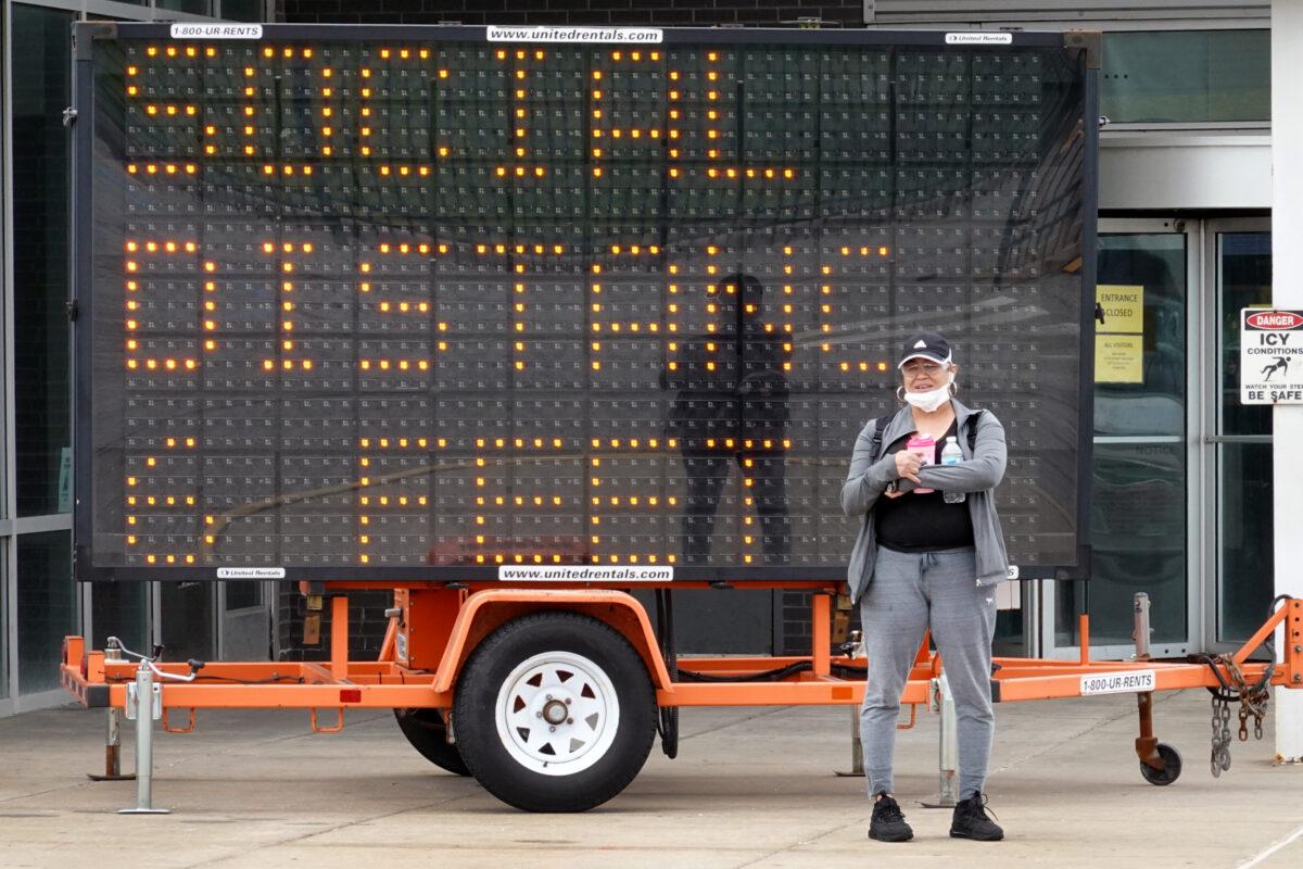 A sign advising people to observe social distancing guidelines outside Ford's Chicago Assembly Plant in Chicago, Ill., on May 20, 2020. (Scott Olson/Getty Images)