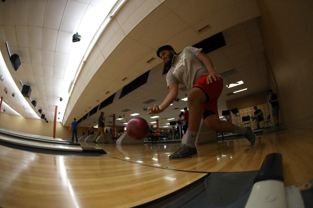 Chris Arellanas bowls at Cowtown Bowling Palace in Fort Worth, Texas, on May 22, 2020. (Ronald Martinez/Getty Images)