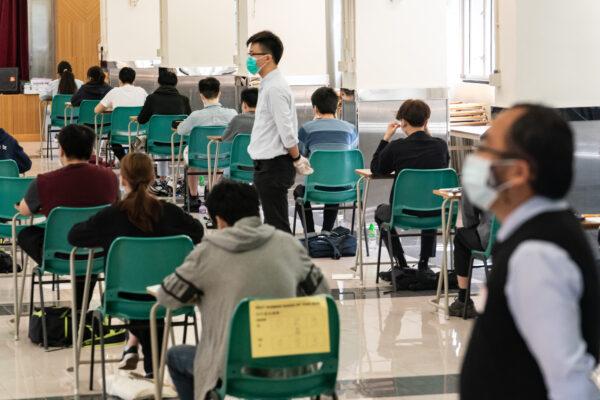 Students sit at a Diploma of Secondary Education (DSE) exams in Hong Kong on April 29, 2020. (Anthony Kwan/Getty Images)