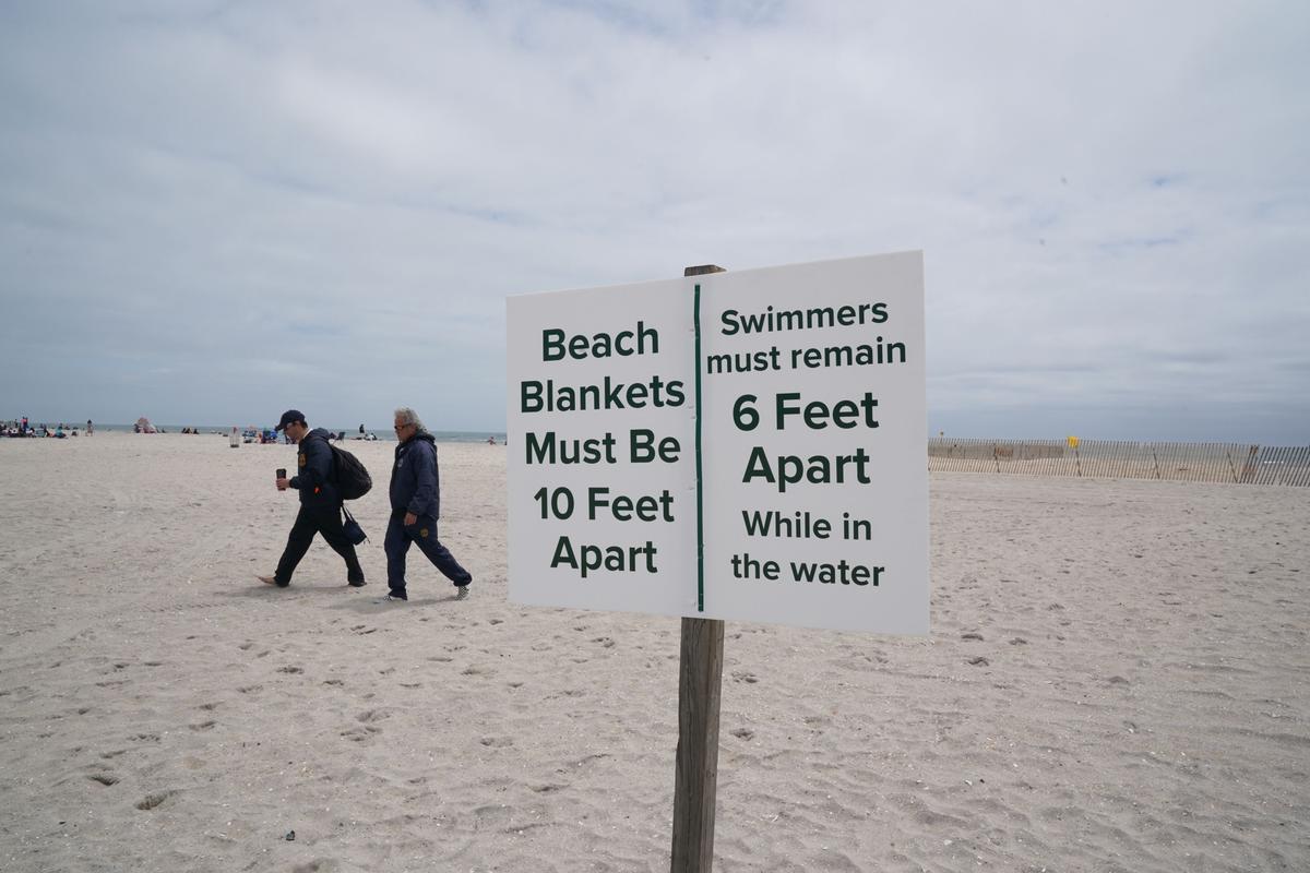 Lifeguards walk along Jones Beach on Long Island, N.Y., on May 24, 2020. (Bryan R. Smith/AFP via Getty Images)