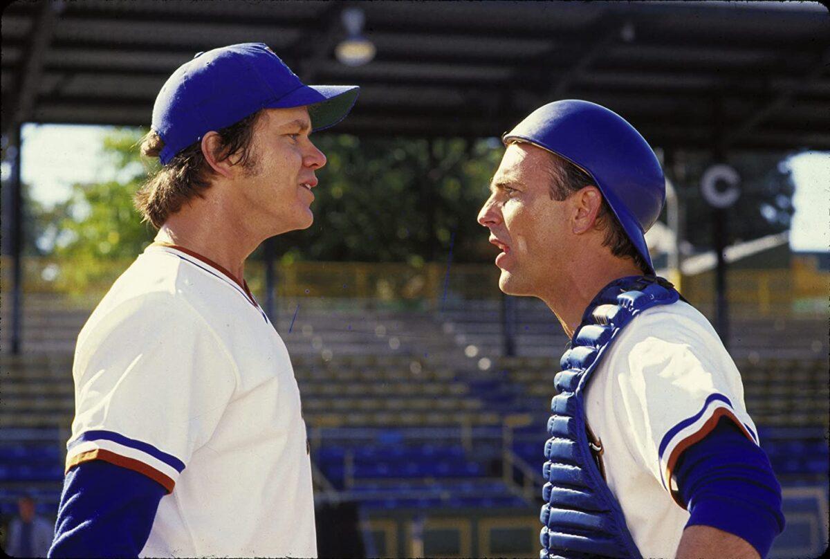 Nuke (Tim Robbins, L) and Crash (Kevin Costner) vehemently discuss why Nuke should not "announce his presence with authority" by throwing a predictable fastball, in "Bull Durham." (Orion Pictures)
