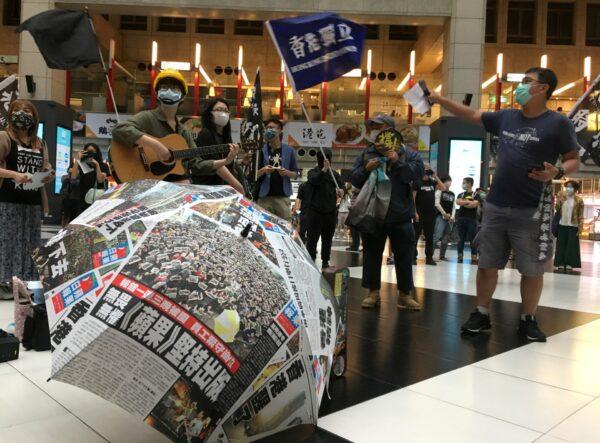 Protesters holding banners in support of Hong Kong pro-democracy demonstrators attend a rally against the Chinese government’s newly announced national security legislation for Hong Kong, at Taipei main train station in Taiwan on May 23, 2020. (Ben Blanchard/Reuters)