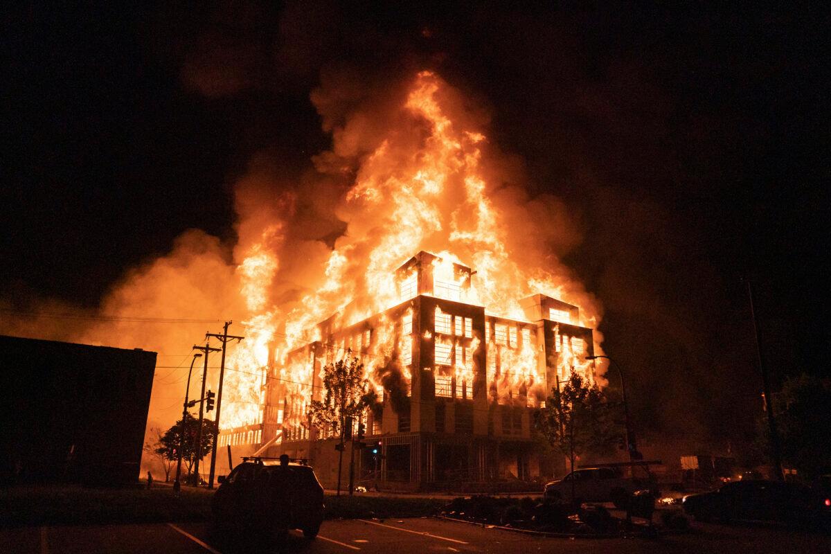 A burning multi-story affordable housing complex under construction near the Third Precinct, in Minneapolis, Minn., on May 27, 2020. (Mark Vancleave/Star Tribune via AP)