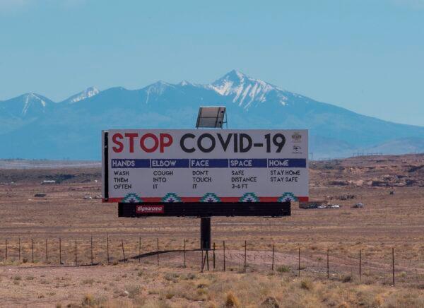 A sign warns against COVID-19 near Tuba City, Ariz., on May 24, 2020. (Mark Ralston/AFP/Getty Images)