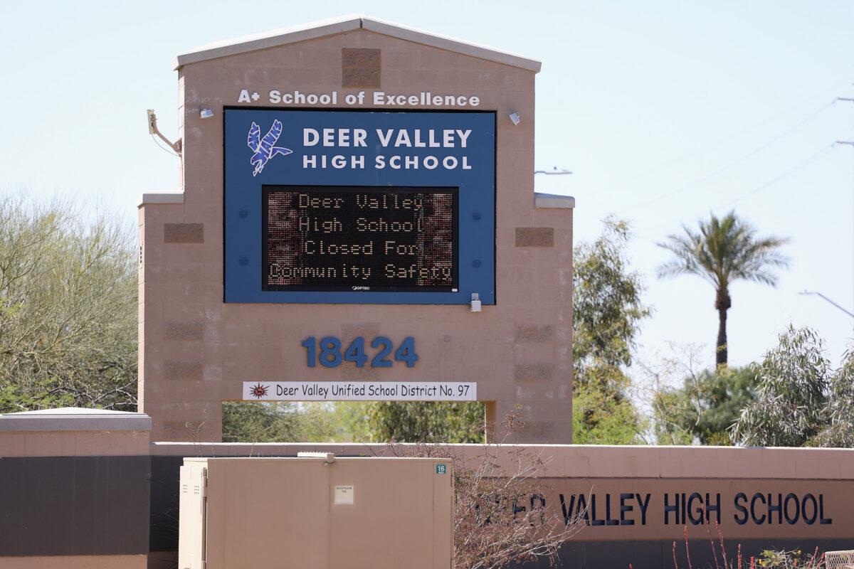 A sign indicating school closure due to the spread of COVID-19 is displayed at Deer Valley High School, in Glendale, Ariz., on April 02, 2020. (Christian Petersen/Getty Images)