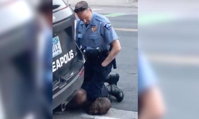 New Video Appears to Show Three Police Officers Kneeling on George Floyd