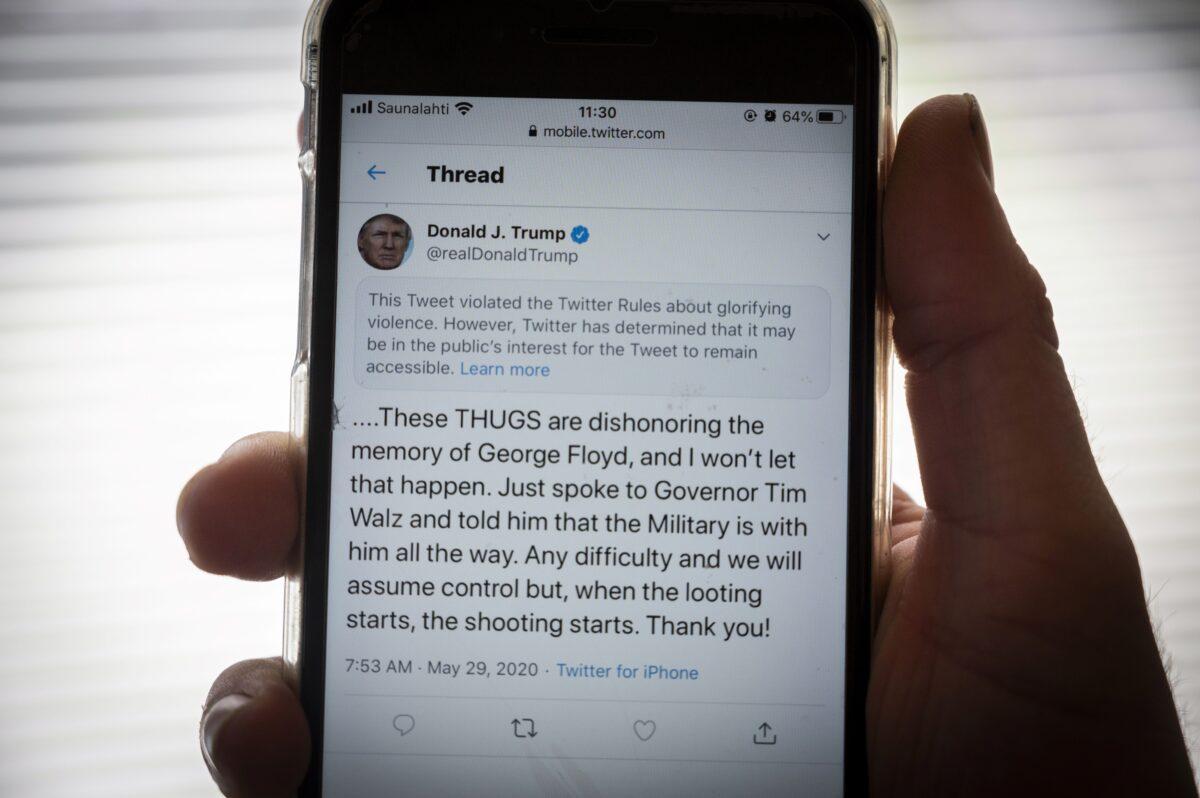 The tweet that Twitter censored, from U.S. President Donald Trump, on a phone in Finland, on May 29, 2020. (Olivier Morin/AFP via Getty Images)
