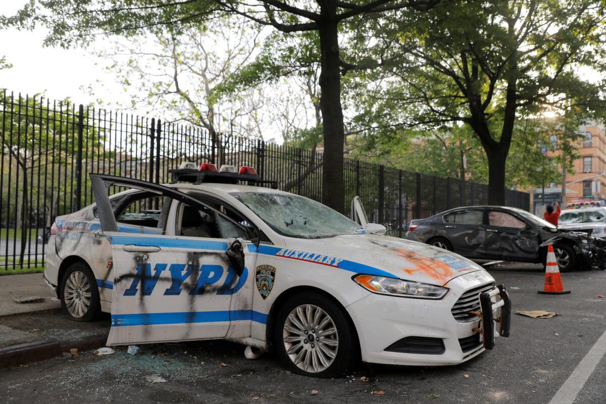 A vandalized New York Police Department vehicle is seen after a protest following the death of George Floyd in Minneapolis Police custody, in New York City, N.Y., on May 30, 2020. (Andrew Kelly/Reuters)