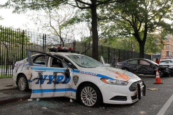 A vandalized New York Police Department vehicle is seen after a protest following the death of George Floyd in Minneapolis Police custody, in New York City, on May 30, 2020. (Andrew Kelly/Reuters)