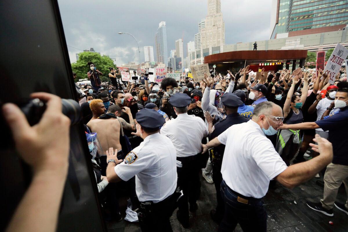 Police try to contain protesters during a rally at the Barclays Center in the Brooklyn borough of New York, N.Y., on May 29, 2020. (Frank Franklin II/AP Photo)