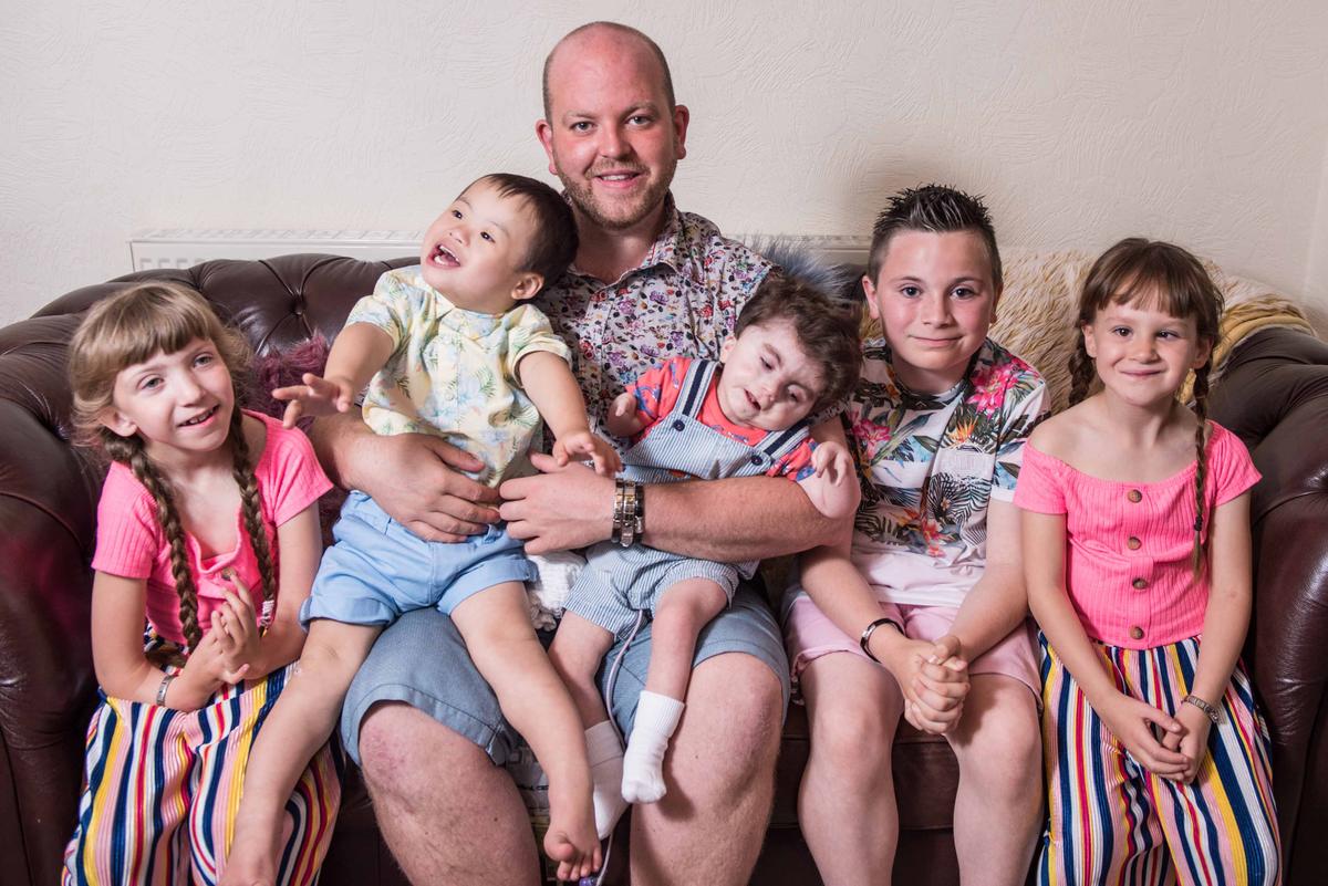 L-R: Ruby, Joseph, Noah, Jack, and Lily with dad Ben Carpenter. (Caters News)