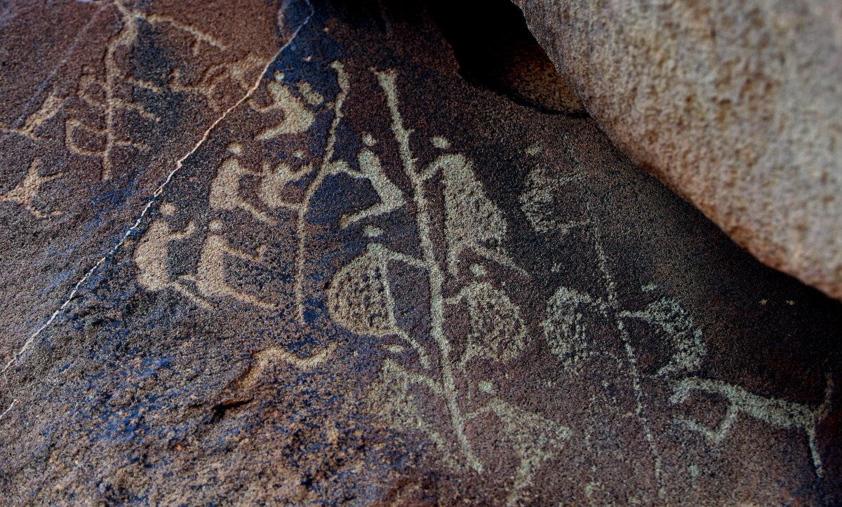 The ancient Aboriginal rock carving known as 'Climbing Man,' believed to be thousands of years old in Burrup Peninsula, Western Australia, on June 17, 2008. (Greg Wood/AFP via Getty Images)