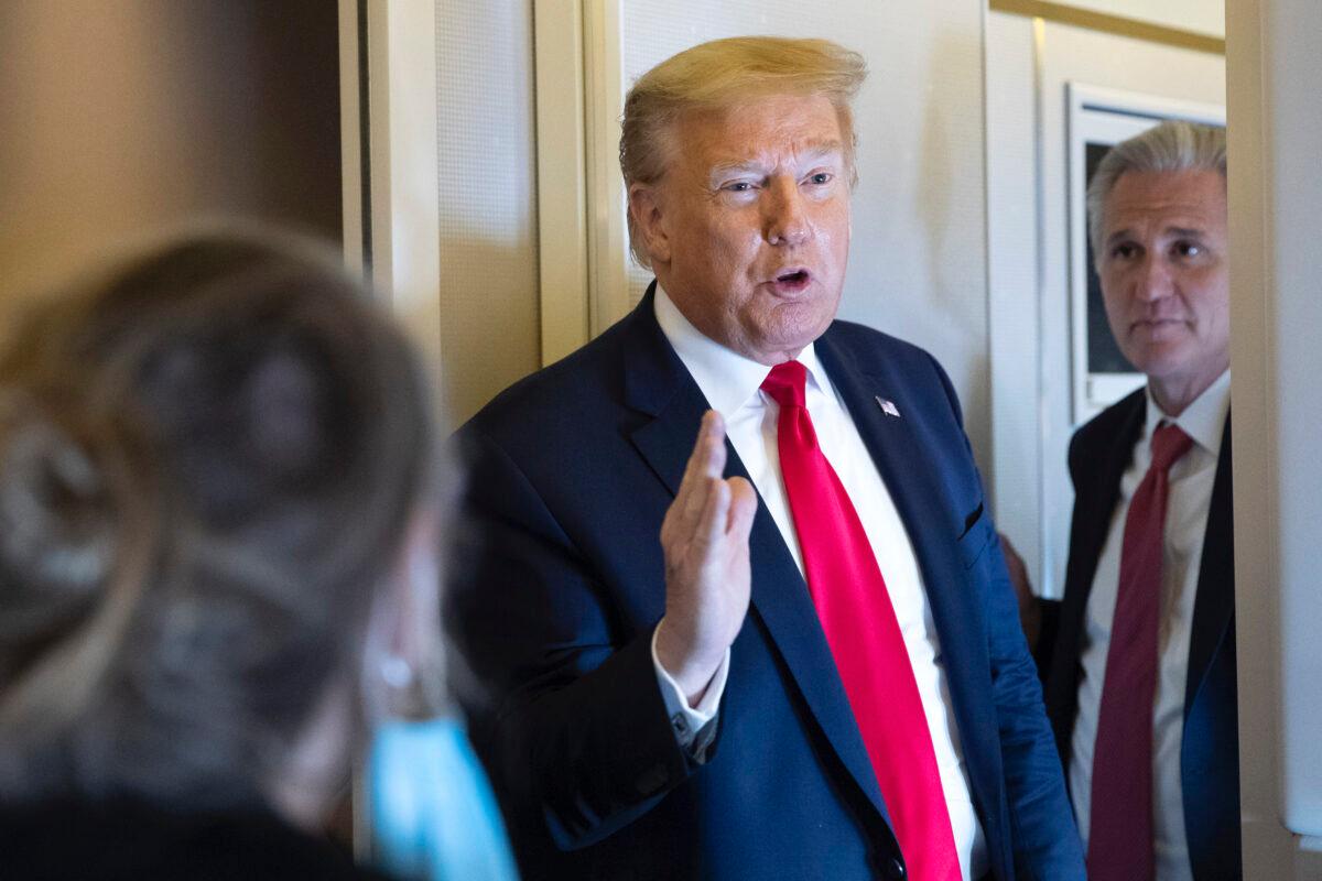 President Donald Trump, with House Minority Leader Kevin McCarthy (R-Calif.), speaks with reporters while being flown to Andrews Air Force Base in flight on May 30, 2020. (Alex Brandon/AP Photo)