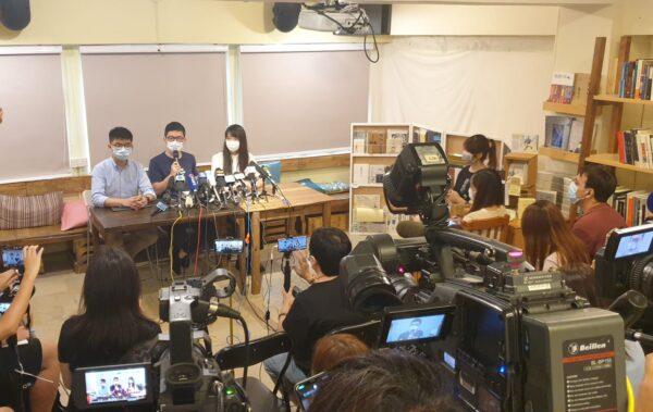 (L-R) Joshua Wong, Nathan Law, and Agnes Chow of the local pro-democracy party Demosistō, hold a press conference in Hong Kong on May 30, 2020. (Xiao Long/The Epoch Times)