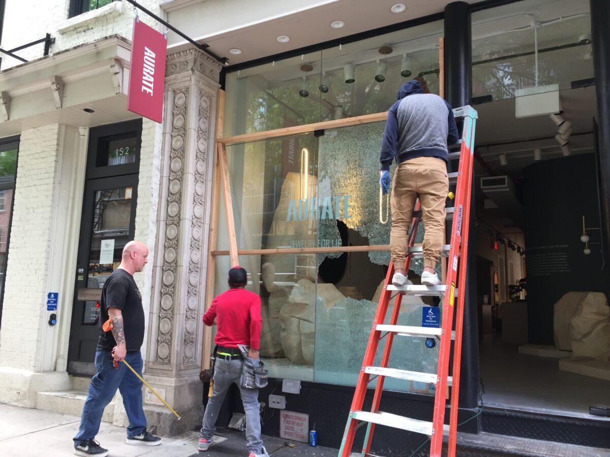 A store damaged during the May 31 night protests in SoHo neighborhood of lower Manhattan, N.Y., on June 1, 2020. (Venus Upadhayaya/The Epoch Times)