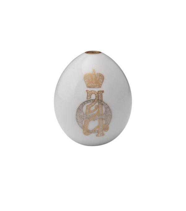 Imperial presentation Easter egg with monogram of Empress Alexandra Feodorovna, 1894–1917, Imperial Porcelain Factory, St. Petersburg, Russia. Porcelain, gilded silver, silver-wrapped silk ribbon. Collection of Nicholas Silao, New York, N.Y. (Museum of Russian Icons)