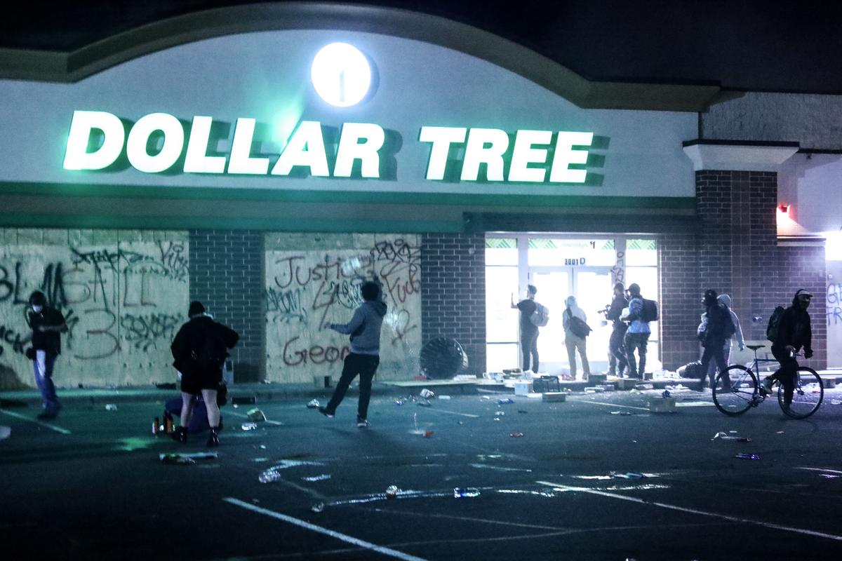 A Dollar Tree store is broken into and looted near the Minneapolis Police 5th Precinct in Minneapolis, Minn., on May 29, 2020. (Charlotte Cuthbertson/The Epoch Times)