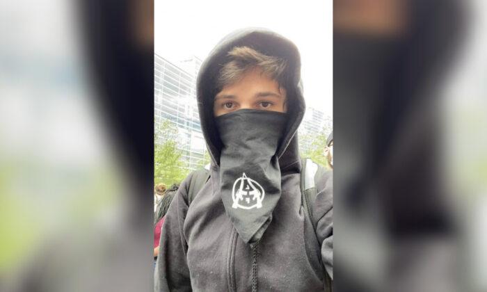 Anarchist Accused of Inciting a Riot Surrenders to Police